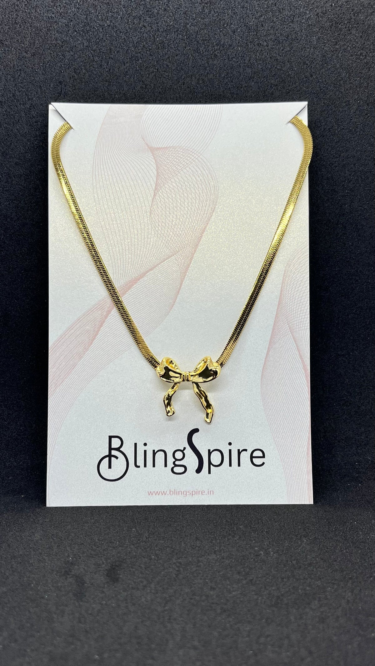 BlingSpire Gold-Tone Snake Chain Necklace with Bow Charm