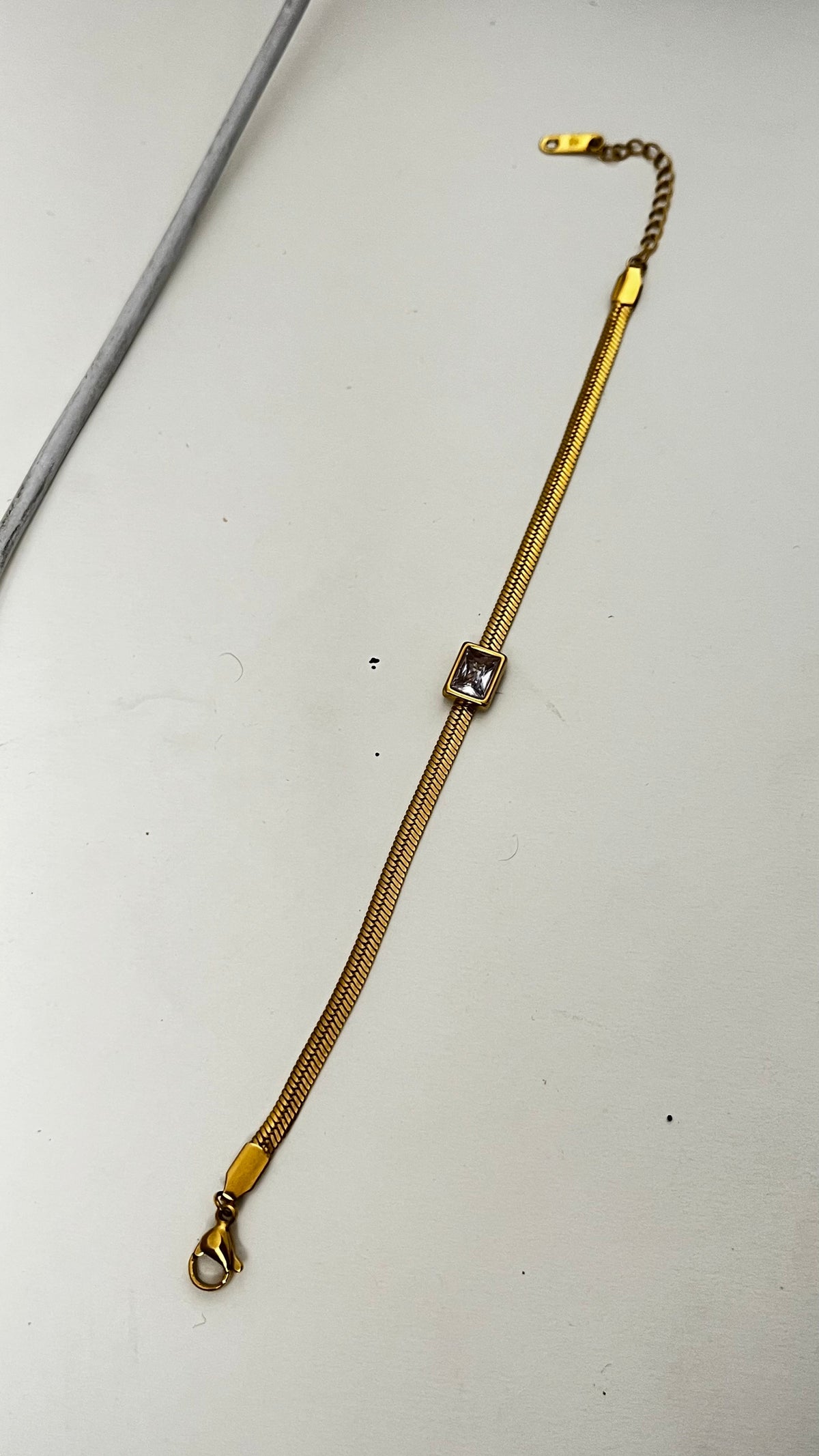 Shimmering Star: Gold-Tone Snake Chain Bracelet