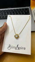 Eternal Elegance: Gold-Tone Knot Pendant Necklace