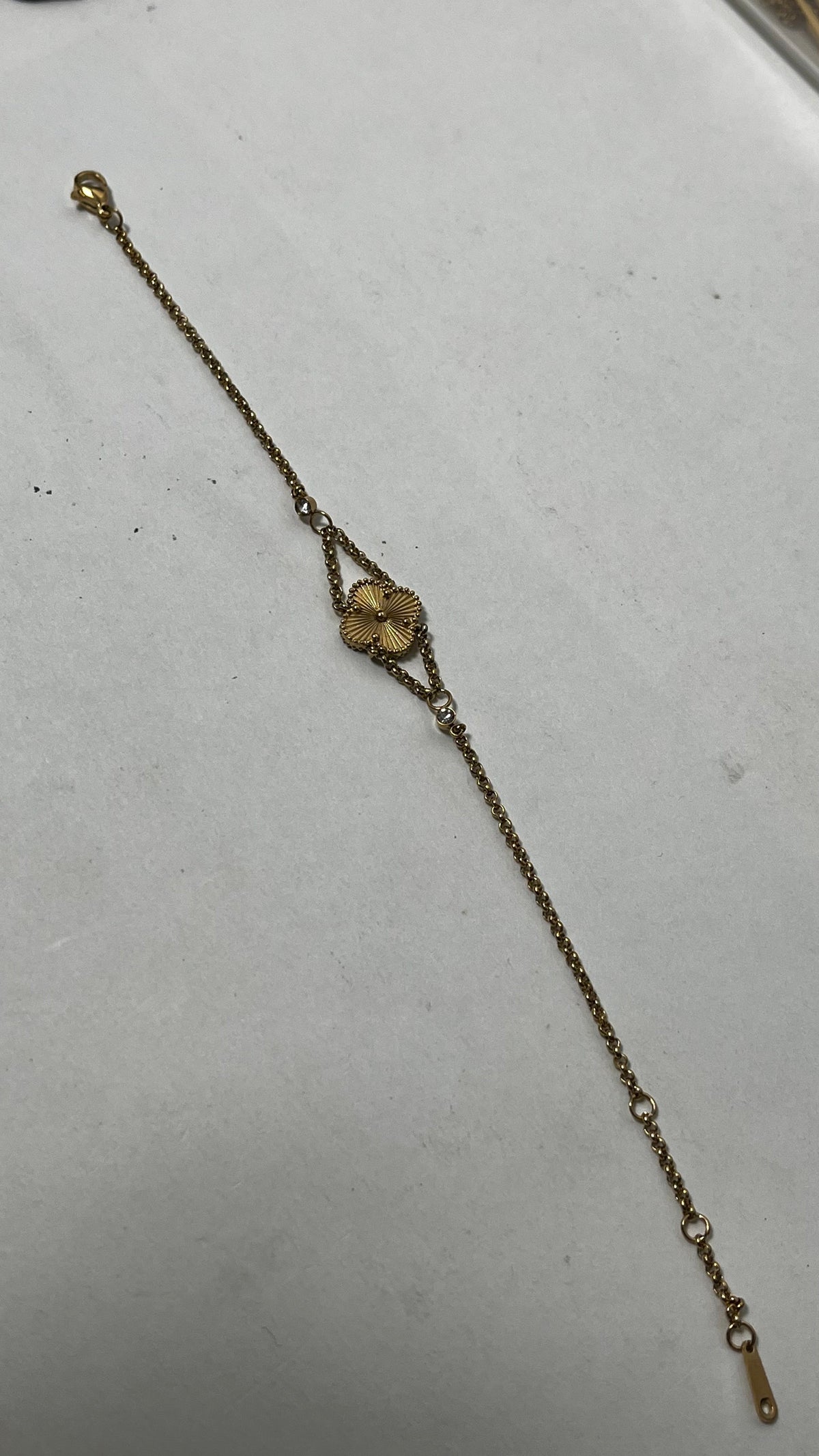 Blooming Beauty: Gold-Tone Flower Charm Bracelet