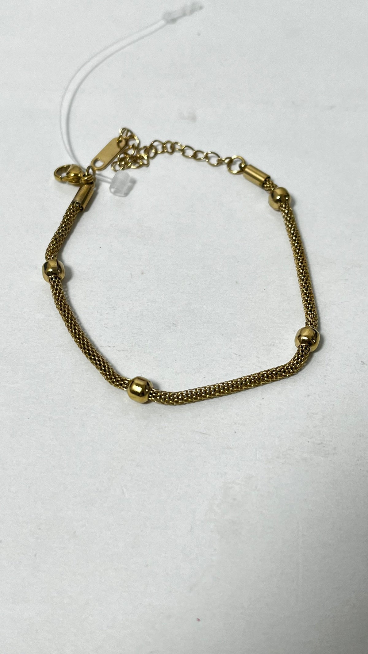 Elegant Simplicity: Gold-Tone Mesh Bracelet